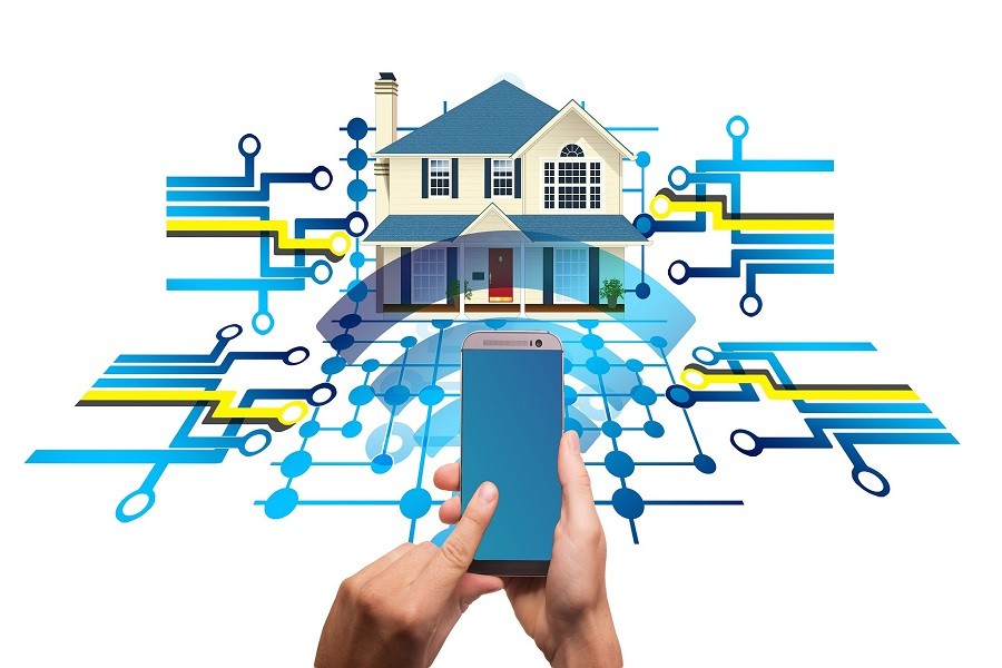 graphic of a house with network connection lines around it with hands holding a mobile device in the foreground. 